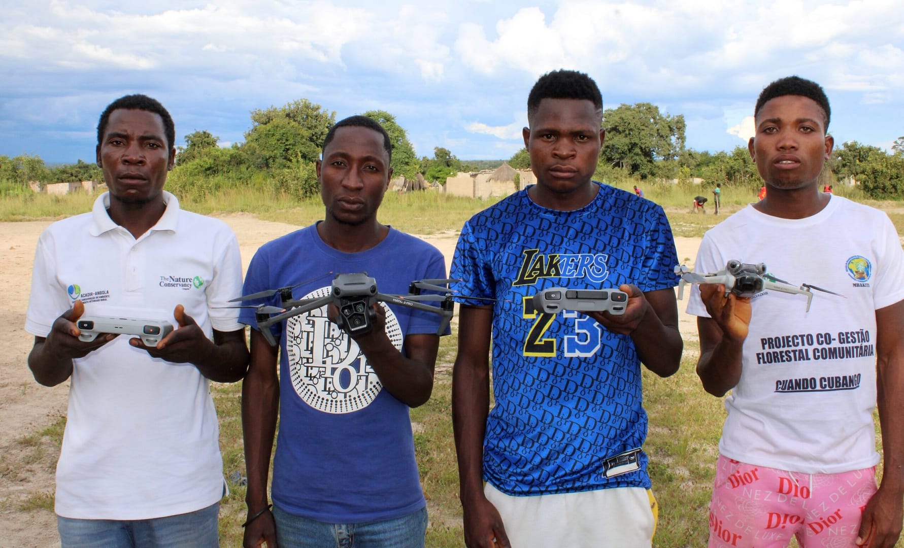 Four young drone operators with their tech.